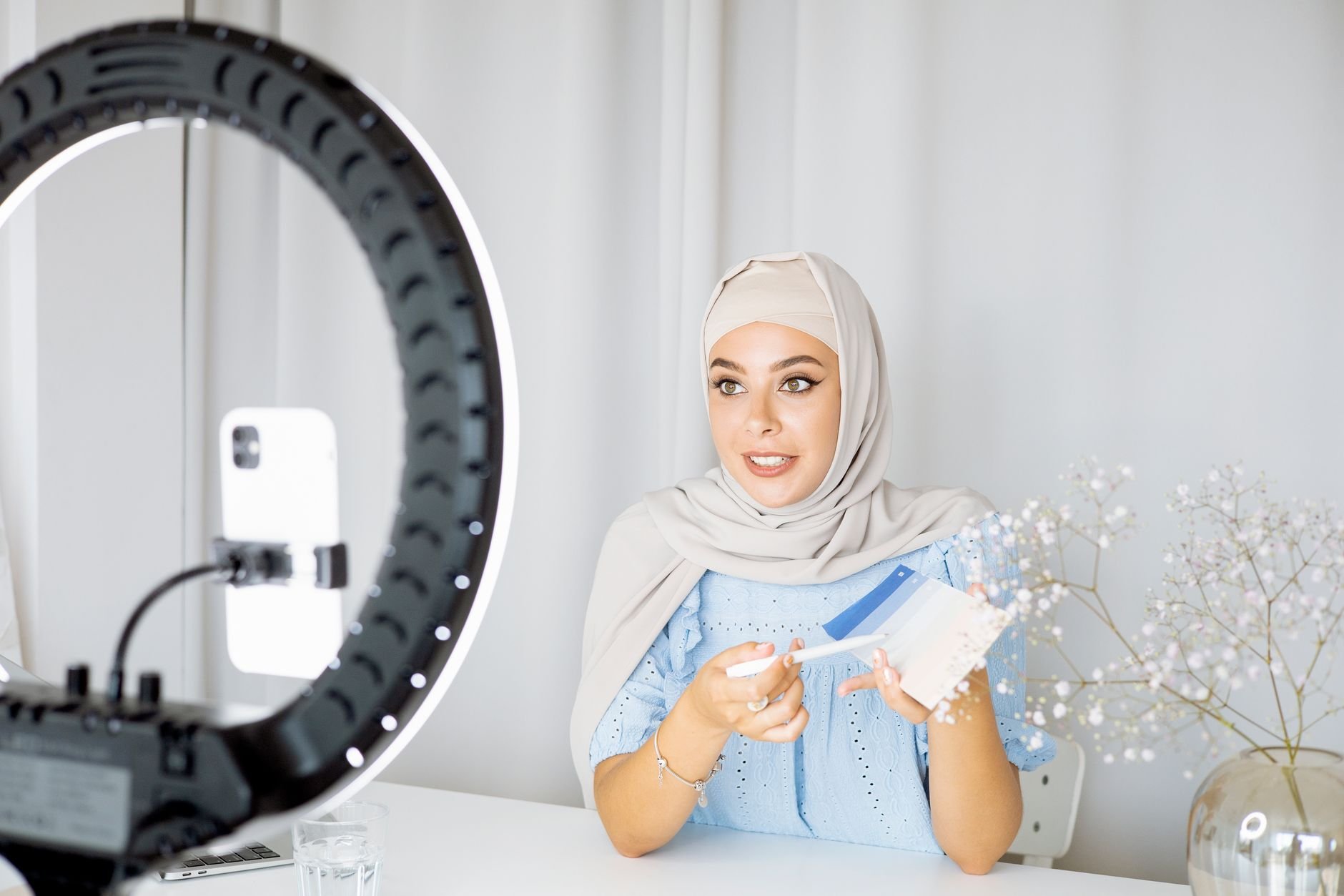 Woman creating social media content on her phone